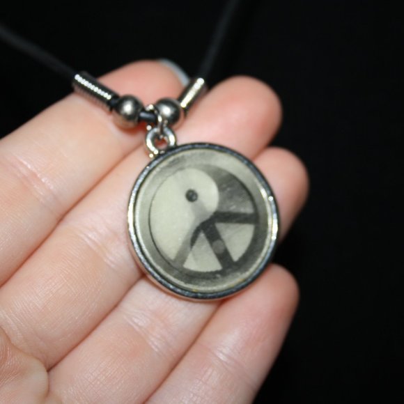 Black cord necklace with peace ying yang pendant